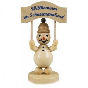 Schneemann Junior mit Schild auf Sockel